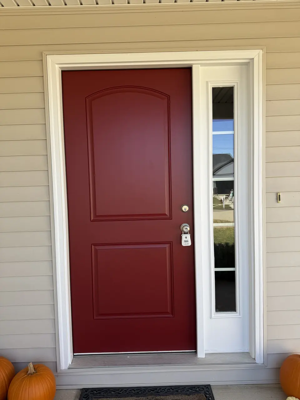 After: White front door painted deep red