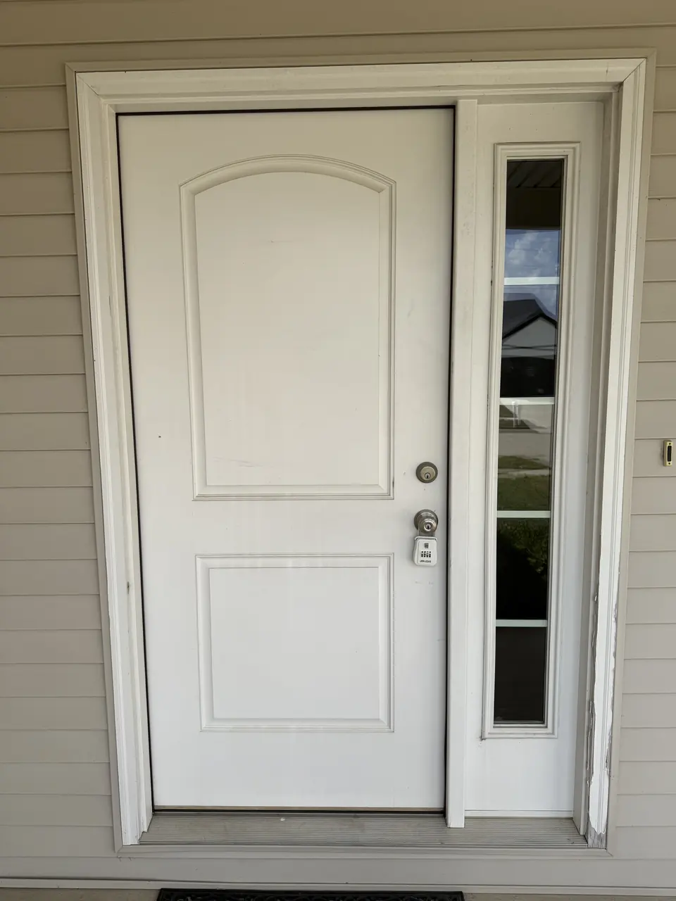Before: White front door painted deep red