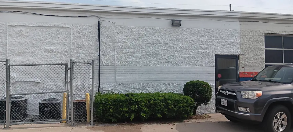 Same commercial wall freshly repainted white