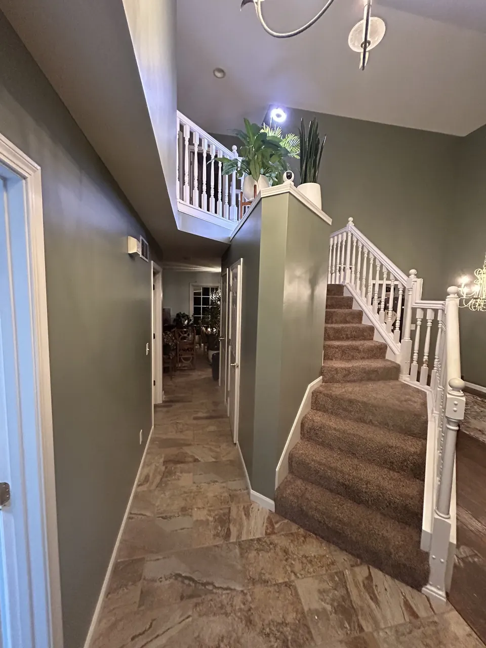 Freshly painted two-story hallway and staircase