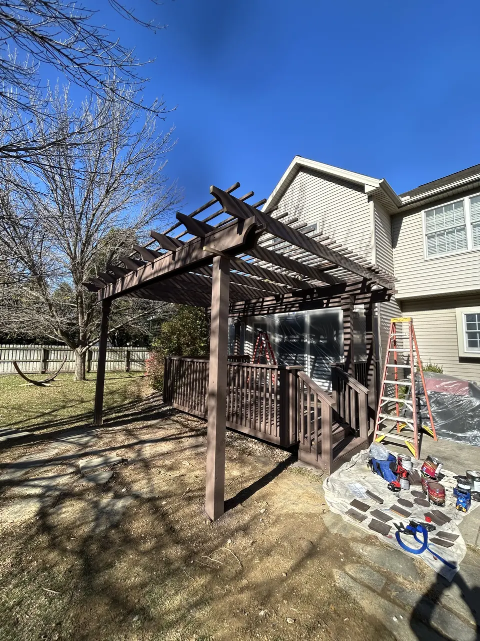 Rebuilt pergola stained dark brown to match the deck