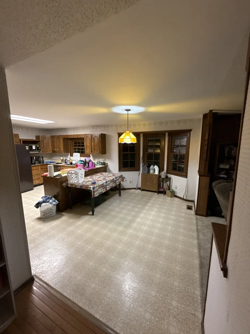 Kitchen and dining area with a smooth ceiling after popcorn removal